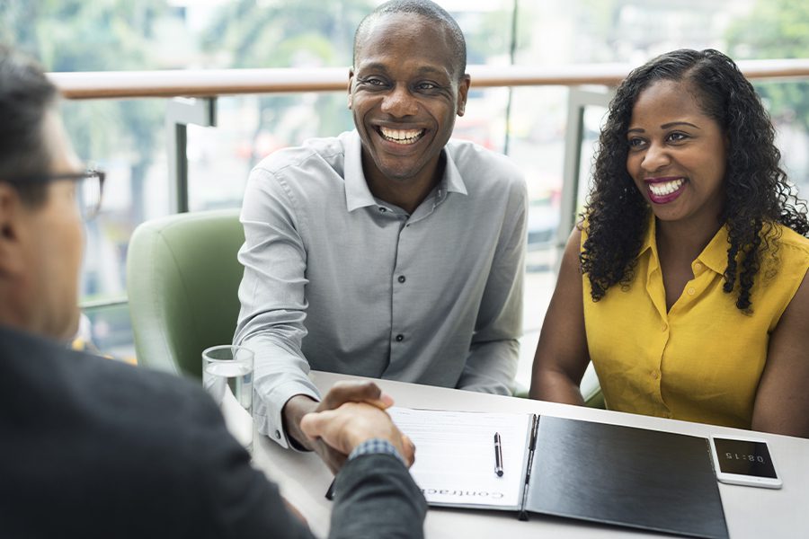 Financial Services - Happy Business Communication Between Financial Agent and Clients in the Office